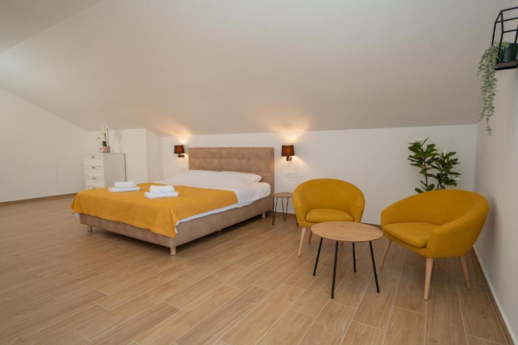 Posteľ alebo postele v izbe v ubytovaní Apartmani Ferdinanda