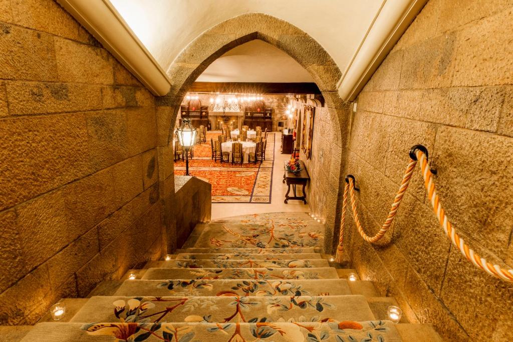 a hallway with ducks on the floor of a building at Hotel Fortaleza do Guincho Relais & Châteaux in Cascais