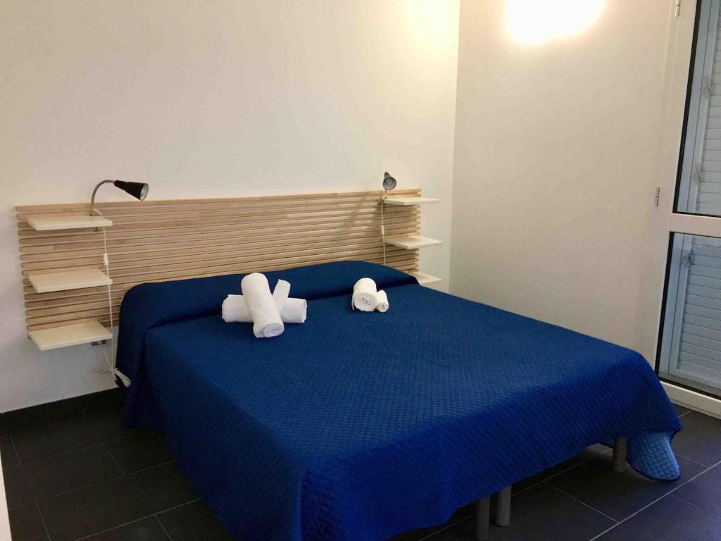 Letto o letti in una camera di Brezza di Levante