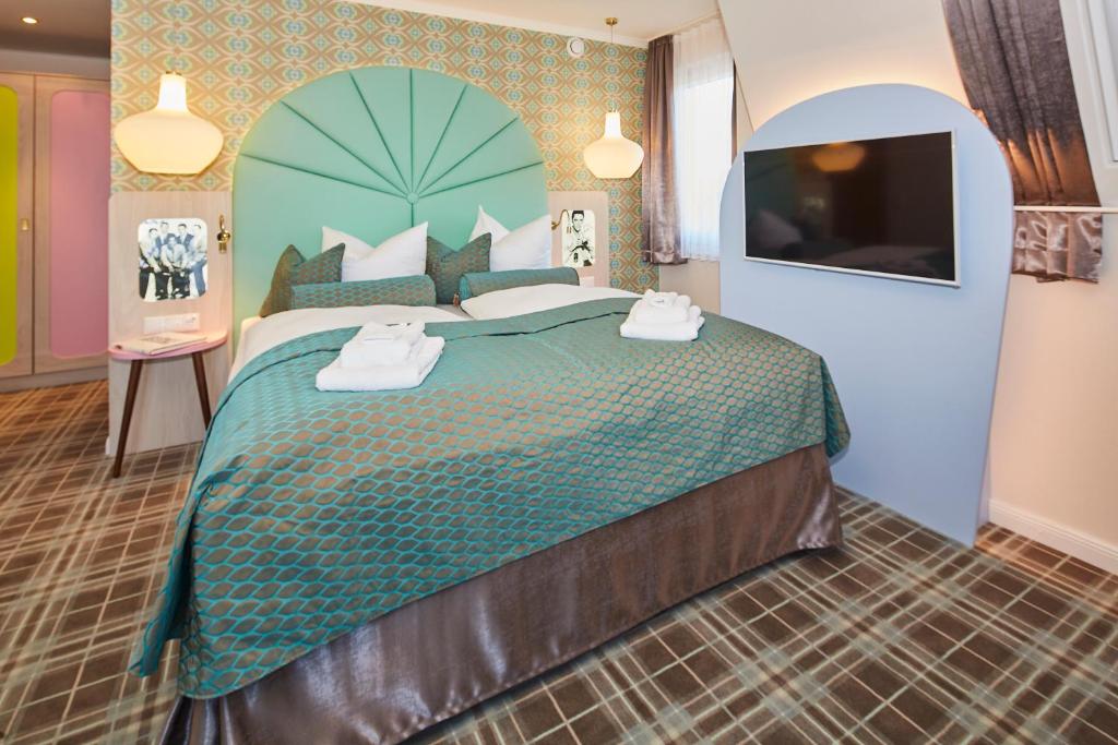 Postel nebo postele na pokoji v ubytování Bernstein Hotel "50`s Seaside Motel"