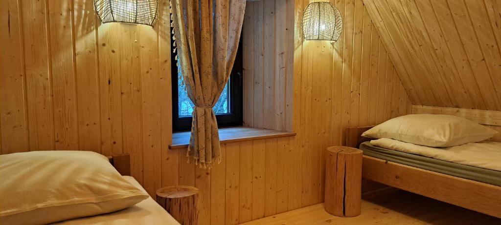 Postel nebo postele na pokoji v ubytování Dom Gościnny Zarembianka