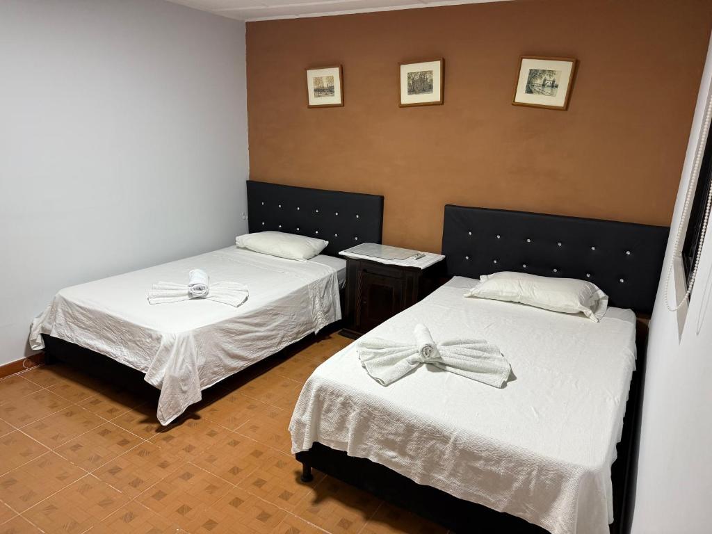 Postel nebo postele na pokoji v ubytování Casa hotel la 33