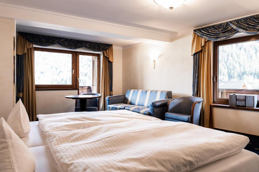 Postel nebo postele na pokoji v ubytování Hotel Maria Theresia