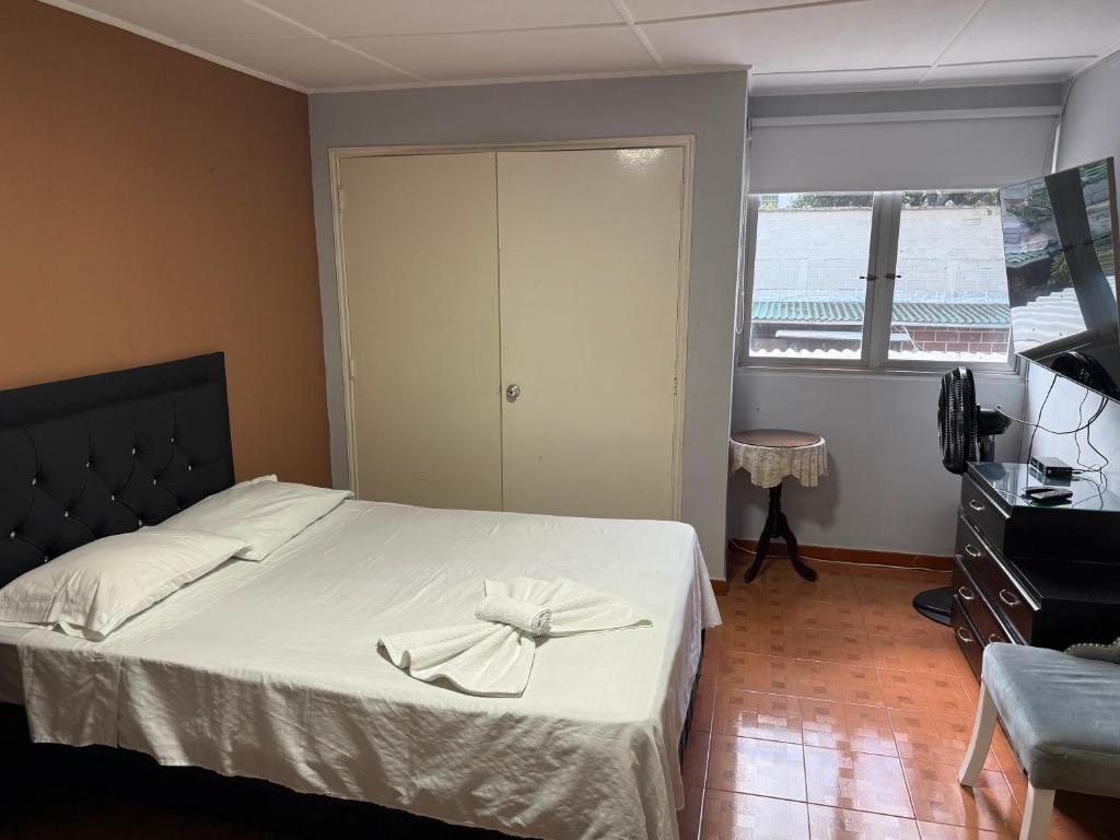 Postel nebo postele na pokoji v ubytování Casa hotel la 33