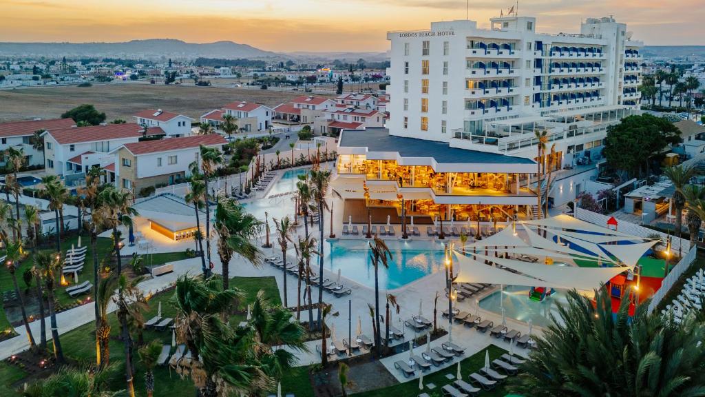 an aerial view of a resort with a pool at Lordos Beach Hotel & Spa in Larnaca