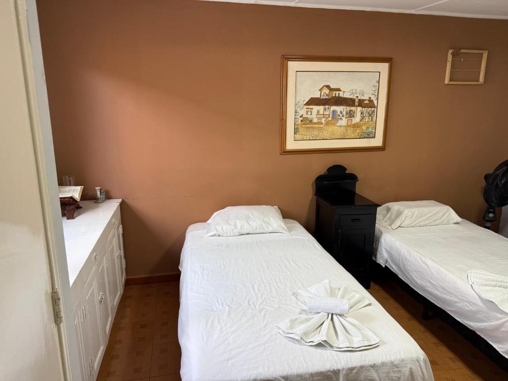 Postel nebo postele na pokoji v ubytování Casa hotel la 33