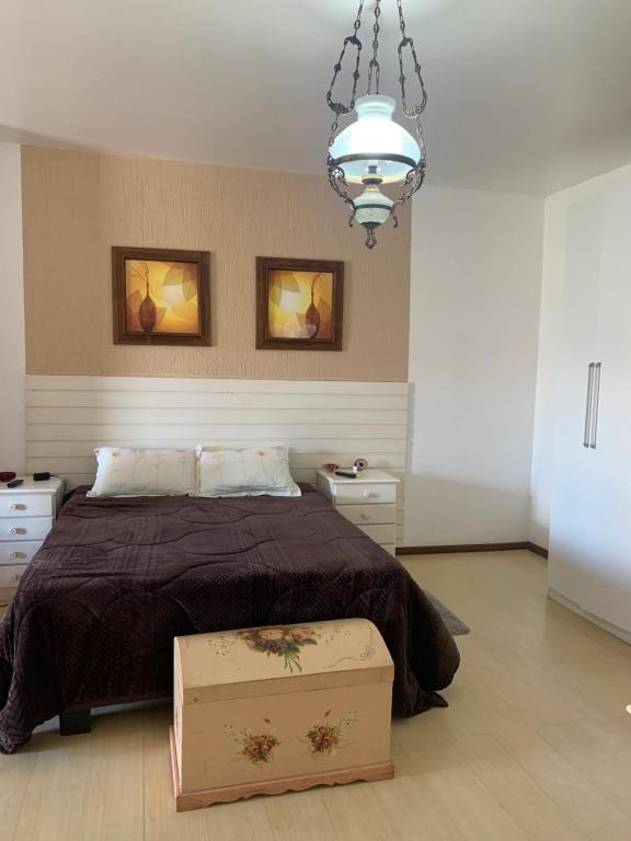 Ένα ή περισσότερα κρεβάτια σε δωμάτιο στο Casa no centro para 8 pessoas