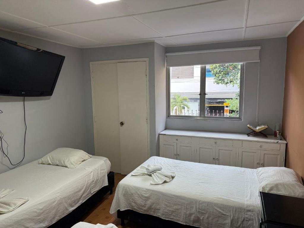 Postel nebo postele na pokoji v ubytování Casa hotel la 33