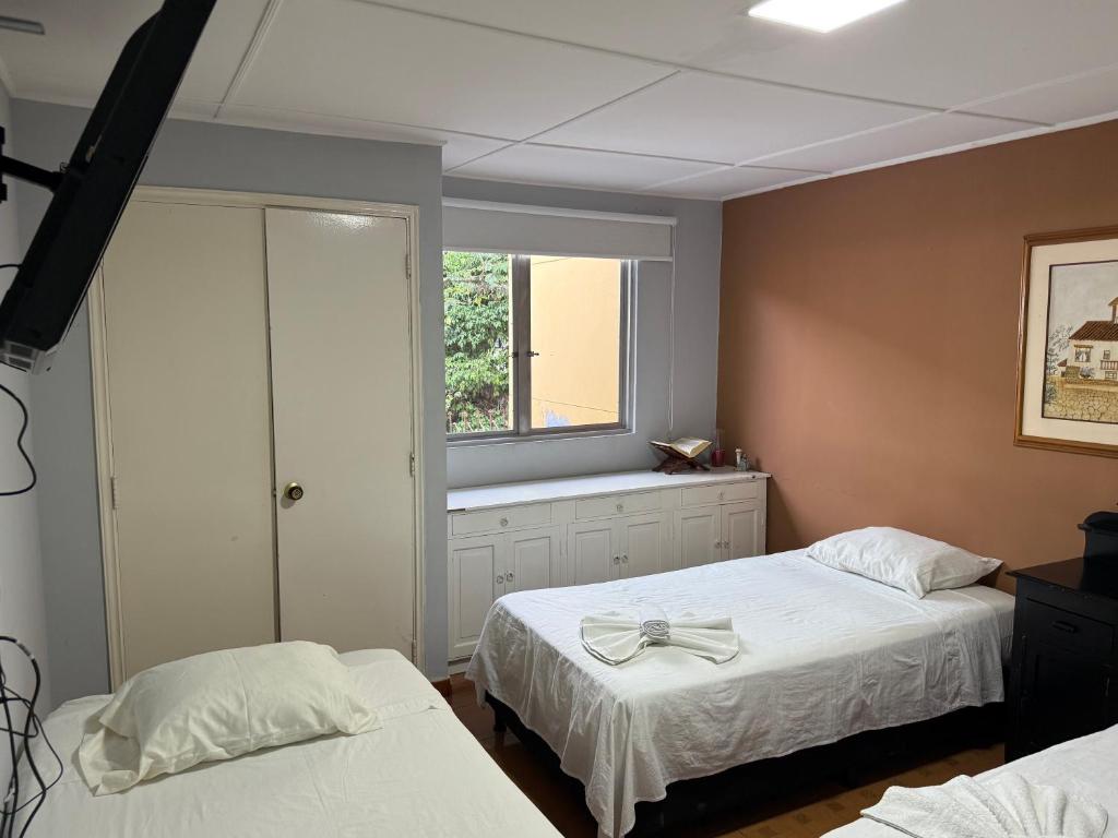 Postel nebo postele na pokoji v ubytování Casa hotel la 33