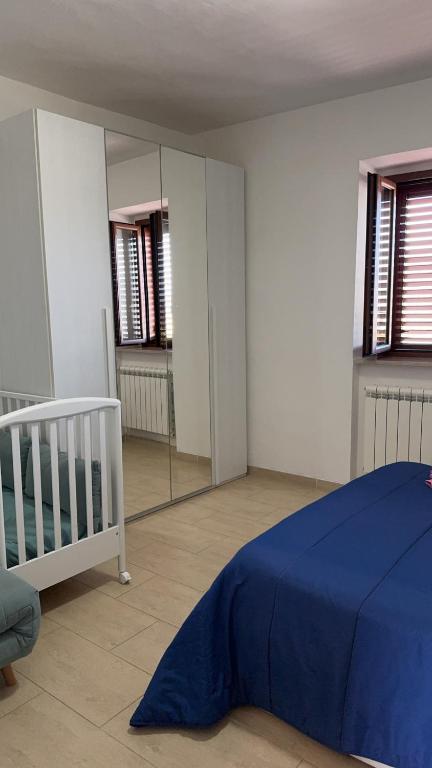 Łóżko lub łóżka w pokoju w obiekcie Casa Vacanze Cerreto 2