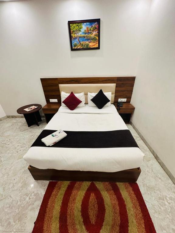 Postel nebo postele na pokoji v ubytování HOTEL S R PLAZAa