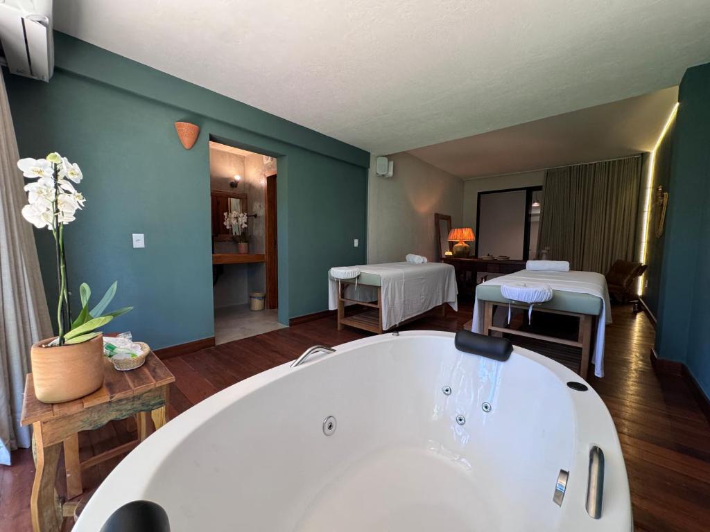 Postel nebo postele na pokoji v ubytování Aysú Trancoso Boutique Hotel