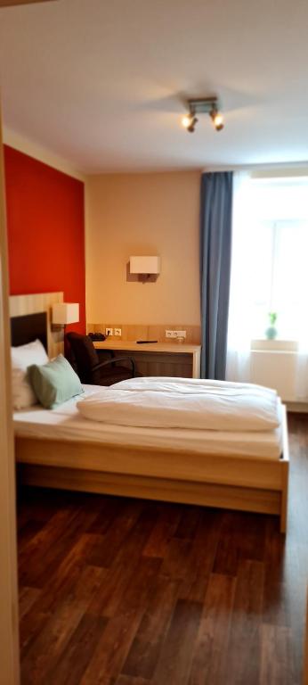 Postel nebo postele na pokoji v ubytování Hotel Pflug