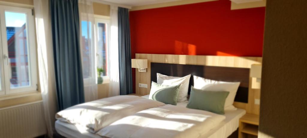 Postel nebo postele na pokoji v ubytování Hotel Pflug