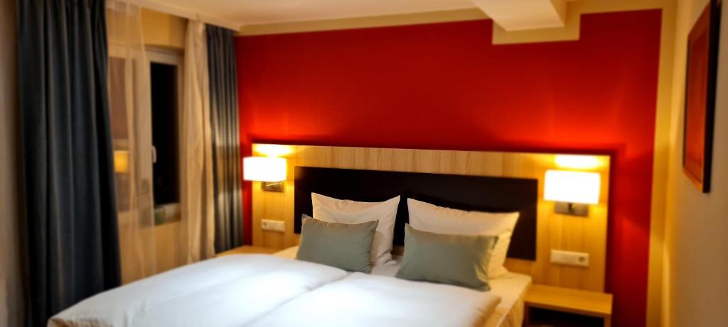 Postel nebo postele na pokoji v ubytování Hotel Pflug
