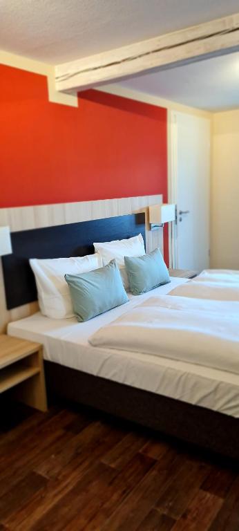 Postel nebo postele na pokoji v ubytování Hotel Pflug
