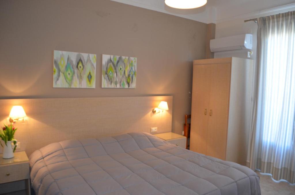 Кровать или кровати в номере Archontissa