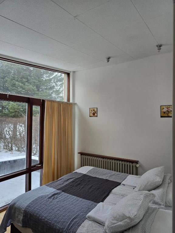 Postel nebo postele na pokoji v ubytování Spói Guesthouse
