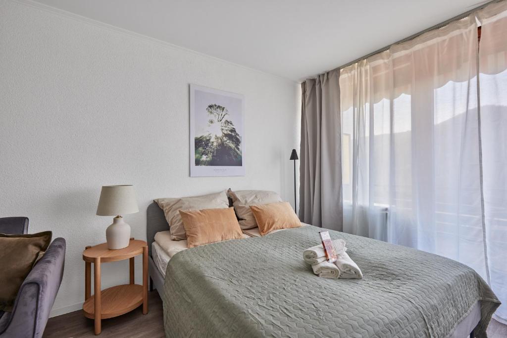 a bedroom with a bed with a stuffed animal on it at Bärbel, im Schwarzwald-Stil in Baiersbronn