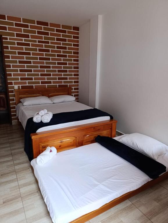 Postel nebo postele na pokoji v ubytování Hotel Macao