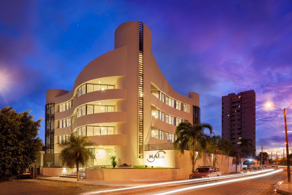 a building on a city street at night at Mai Suites Apart Hotel in Santa Cruz de la Sierra