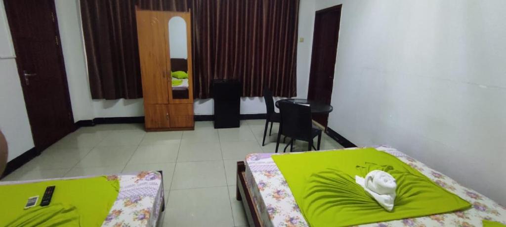 Postel nebo postele na pokoji v ubytování Britos Hotel
