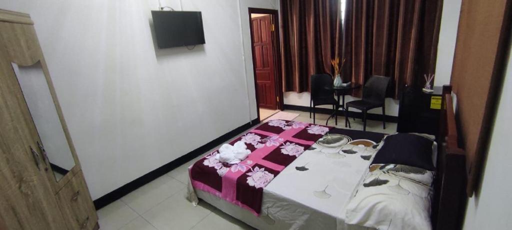 Postel nebo postele na pokoji v ubytování Britos Hotel