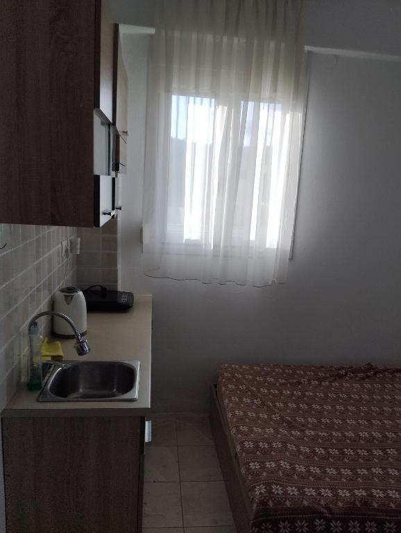Kuchyň nebo kuchyňský kout v ubytování Apartment Irini
