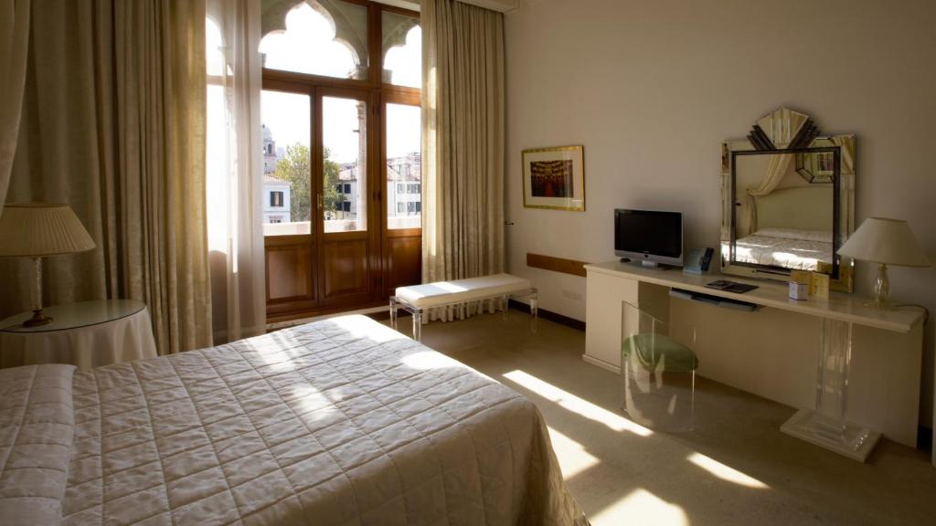 Postel nebo postele na pokoji v ubytování Hotel Principe