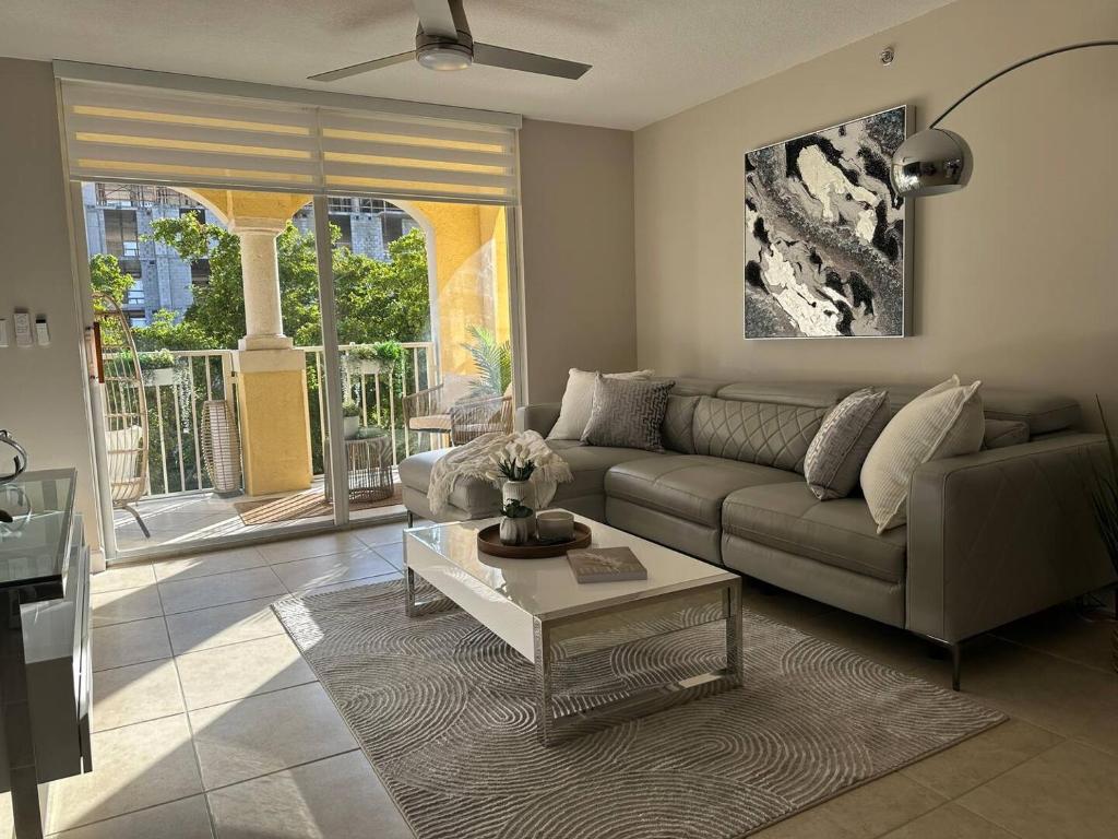 a living room with a couch and a coffee table at Urban Luxe Aventura 22 Retreat in Aventura