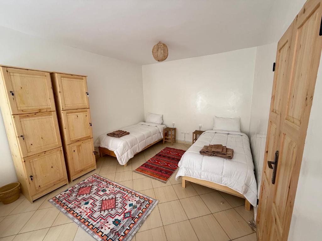 Postel nebo postele na pokoji v ubytování Orange Surf House