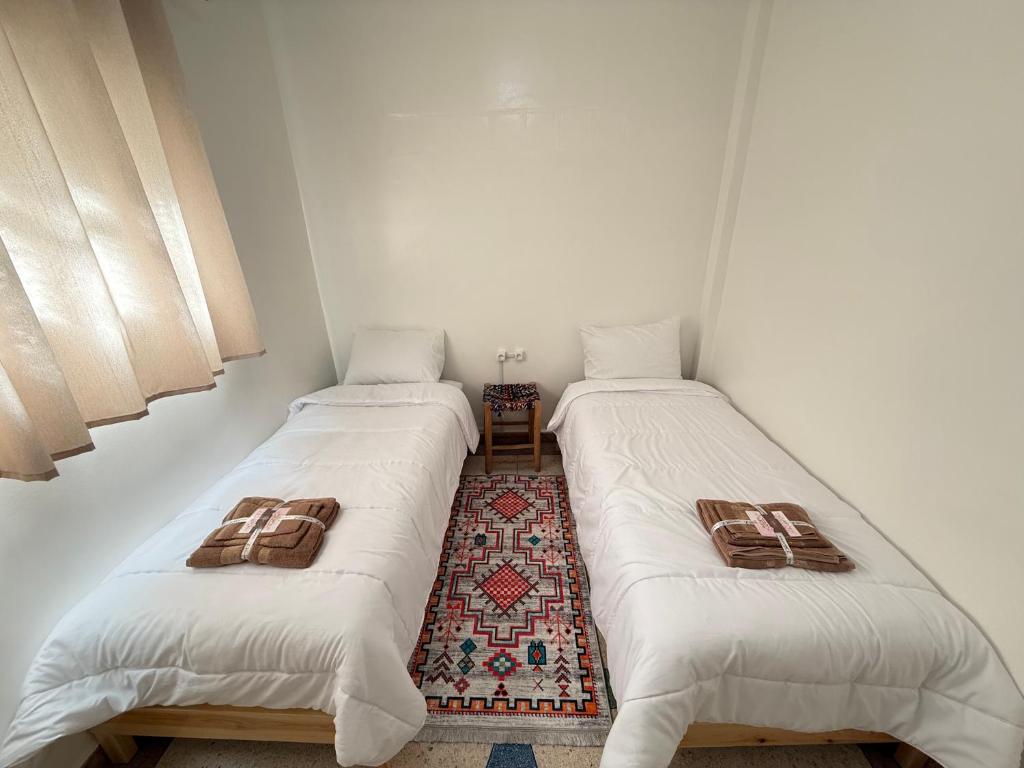 Postel nebo postele na pokoji v ubytování Orange Surf House