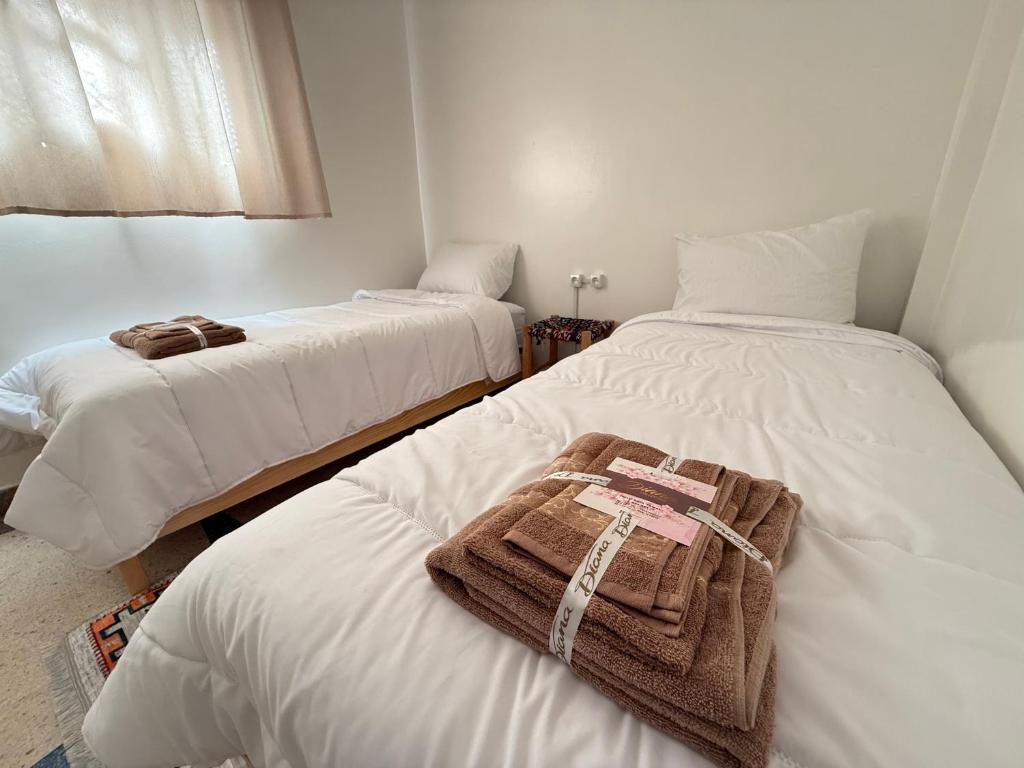 Postel nebo postele na pokoji v ubytování Orange Surf House