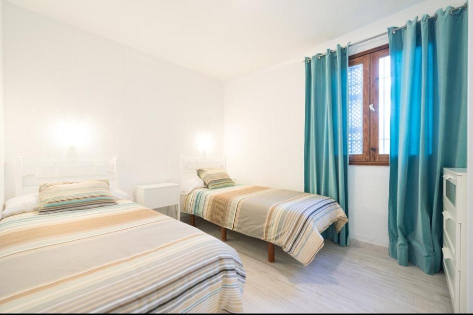 Posteľ alebo postele v izbe v ubytovaní Bonito Bungalow a pocos metros de la playa