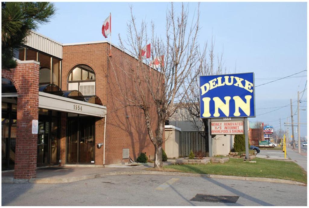 a sign for a bubble inn on the side of a street at Deluxe Inn in Toronto