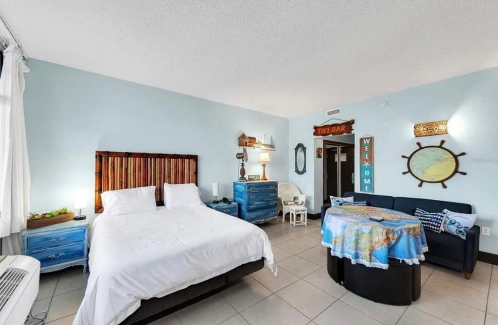 a bedroom with a large bed and blue walls at Little Harbor Resort #301 Tampa Bay FL Beach, Nautical Paradise in Ruskin
