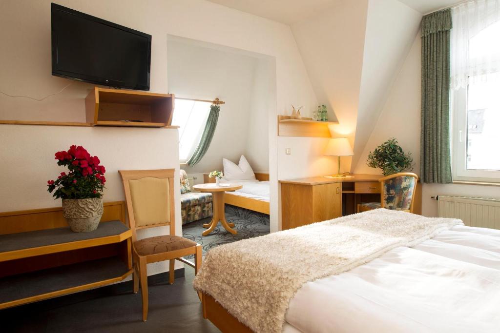 Postel nebo postele na pokoji v ubytování Hotel Heinz
