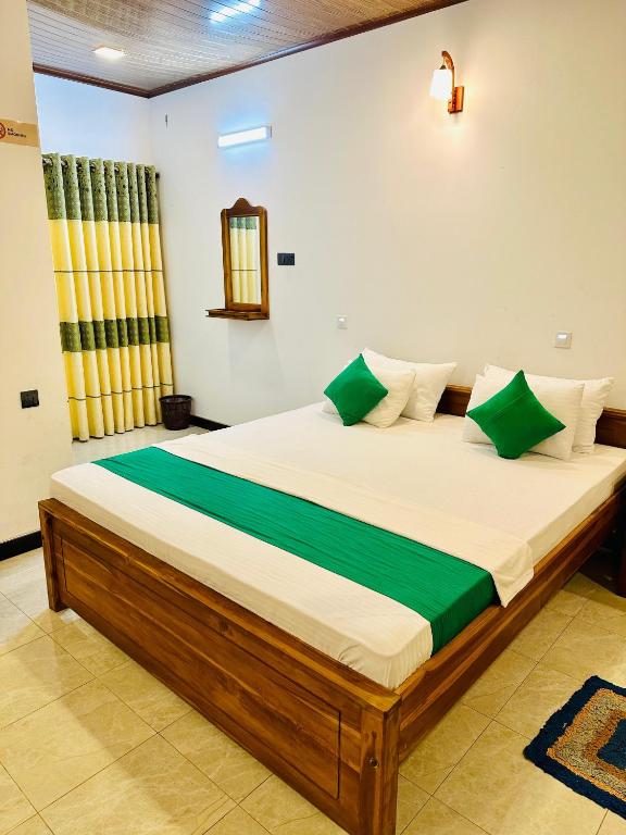 Postel nebo postele na pokoji v ubytování Ceylon Safari Cottage