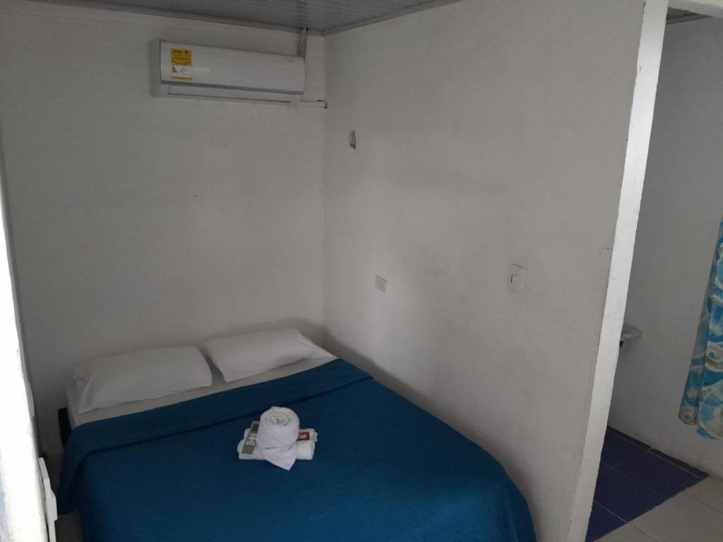 Postel nebo postele na pokoji v ubytování Hostal Makesa Tatacoa