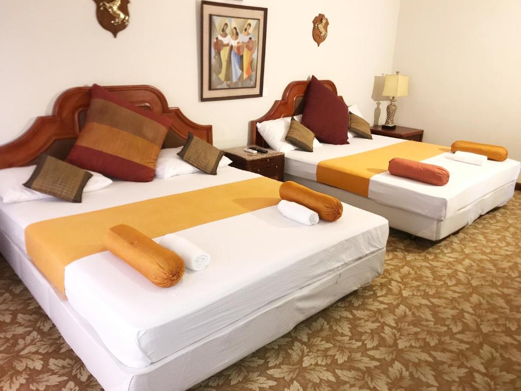 Postel nebo postele na pokoji v ubytování Nature Resort Layathraa