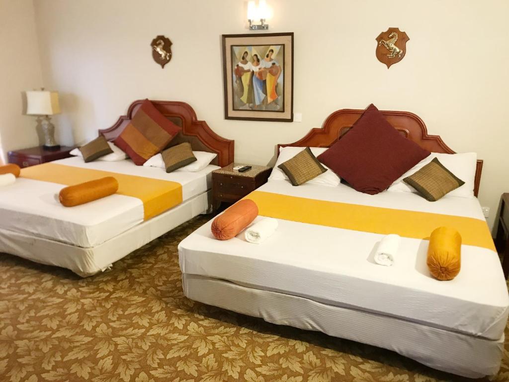 Postel nebo postele na pokoji v ubytování Nature Resort Layathraa