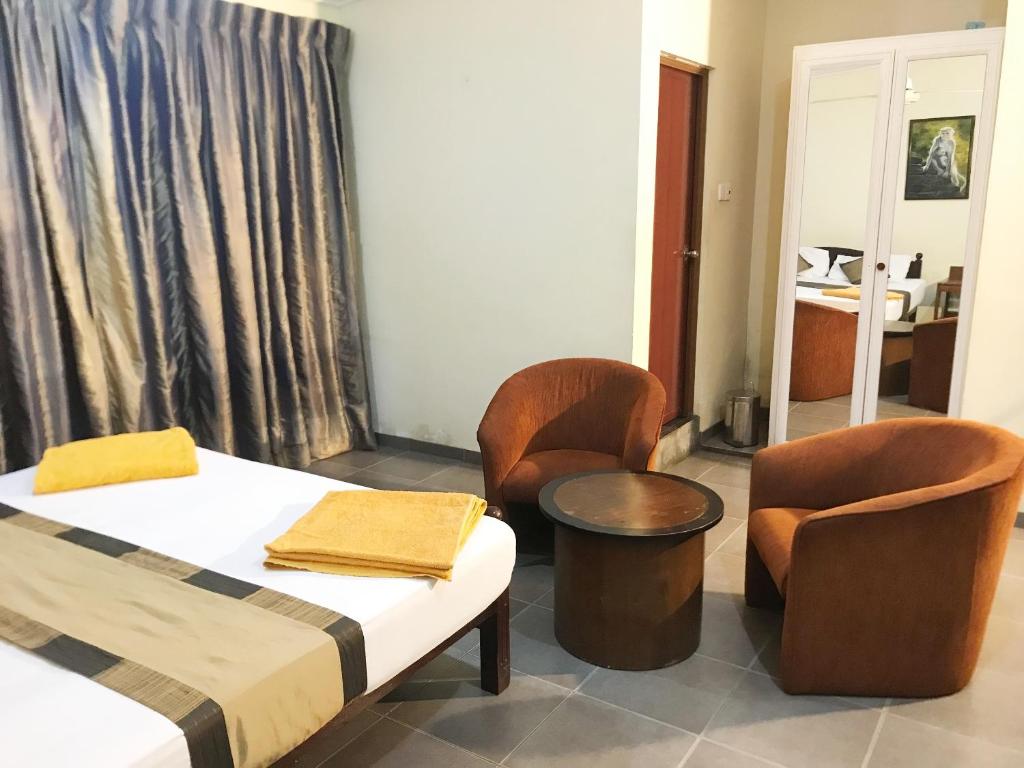 Postel nebo postele na pokoji v ubytování Nature Resort Layathraa