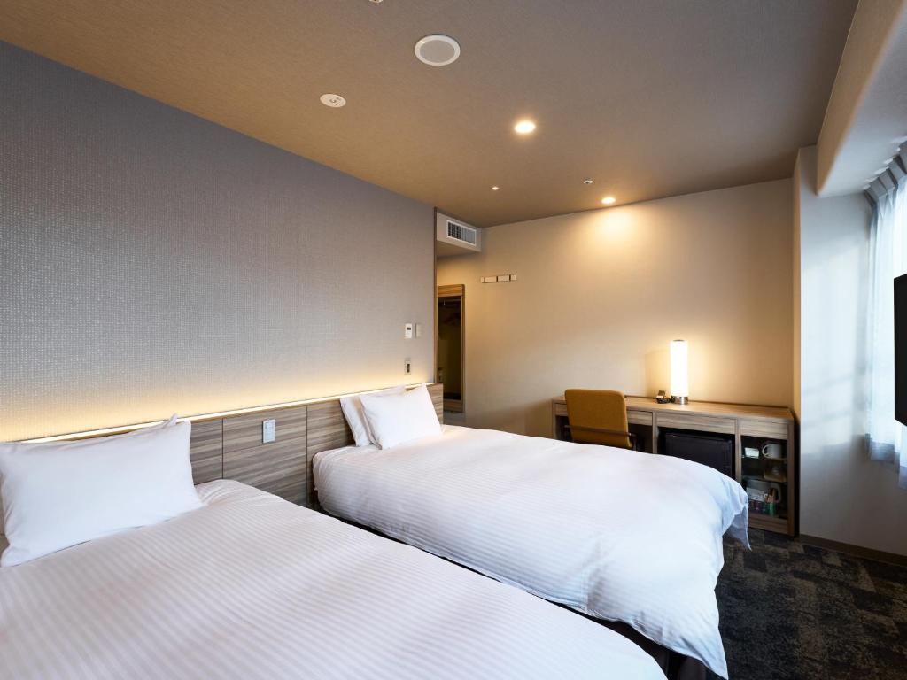 Postel nebo postele na pokoji v ubytování Hotel Elcient Kyoto Hachijoguchi