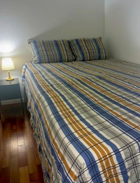 Ένα ή περισσότερα κρεβάτια σε δωμάτιο στο Quarto Em Laranjeiras