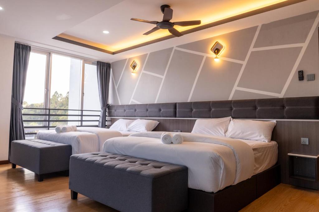 Rúm í herbergi á Sunrisestay