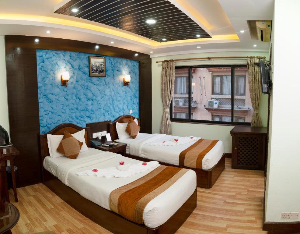 Postel nebo postele na pokoji v ubytování Samsara Boutique Hotel