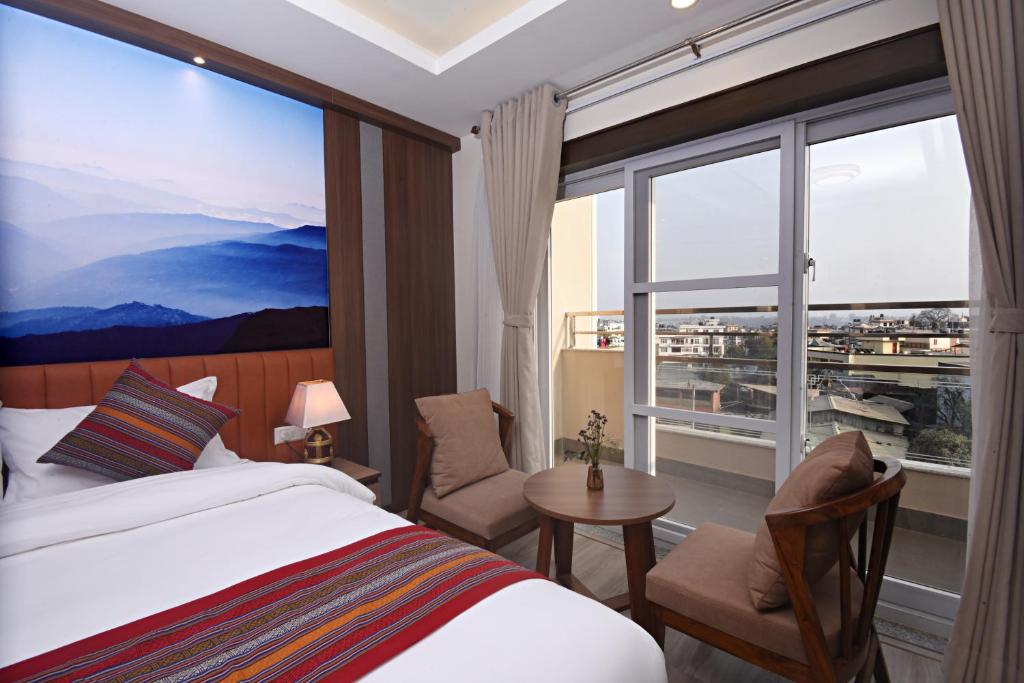 Postel nebo postele na pokoji v ubytování Hotel Sherpani