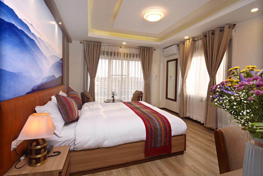Postel nebo postele na pokoji v ubytování Hotel Sherpani