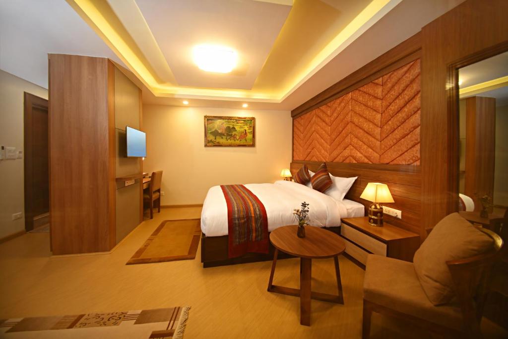 Postel nebo postele na pokoji v ubytování Hotel Sherpani