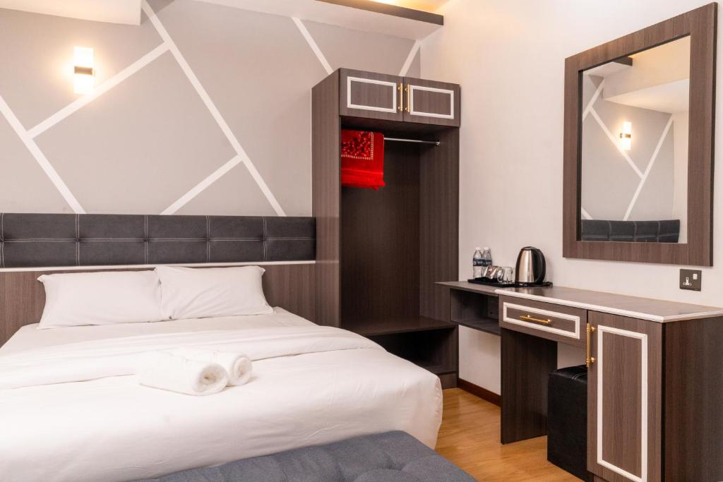 Rúm í herbergi á Sunrisestay